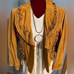 Pamela McCoy Ginuwine leather coat with 100% polyester lining.